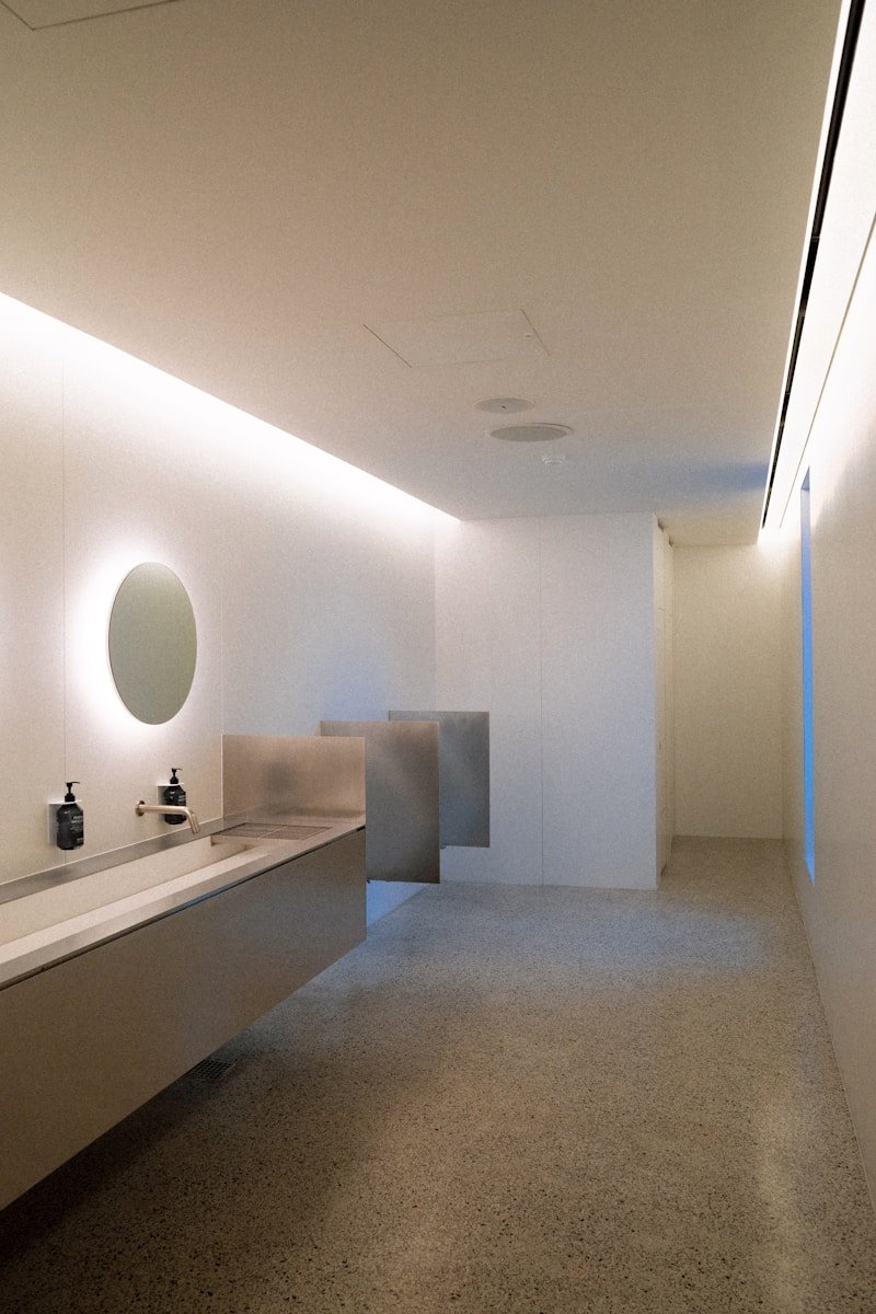 A bathroom with two sinks and a mirror